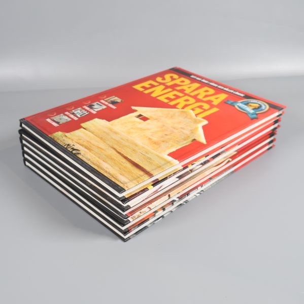 Handverksböcker staplade snett med omslaget Spara energi överst