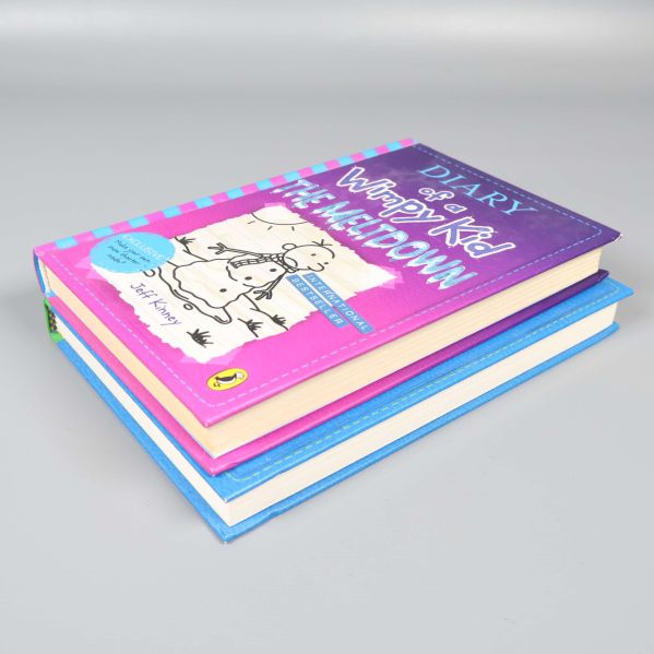 Diary of a Wimpy Kid The Meltdown ovanpå The Getaway, visat från sidan