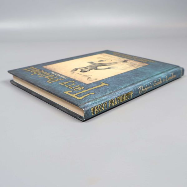 Boken Dodger's Guide to London liggande med ryggen synlig