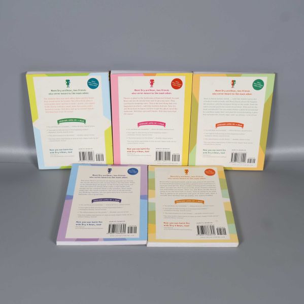 Baksidor av fem Ivy + Bean-böcker med texter och streckkoder