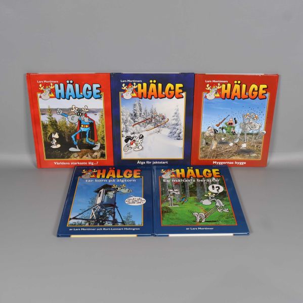 Fem Hälge serieböcker upplagda sida vid sida med färgglada omslag