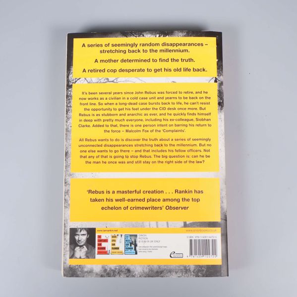 Baksidan av boken Standing in Another Man's Grave med beskrivning och ISBN