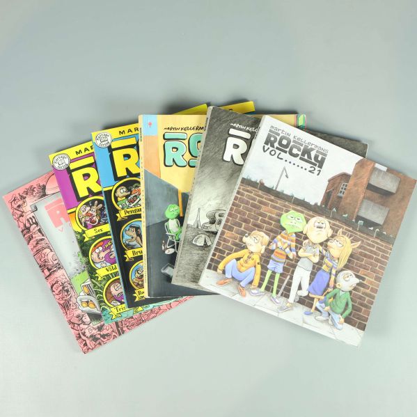 Sex Rocky-serieböcker i färg, framifrån i fläktad hög