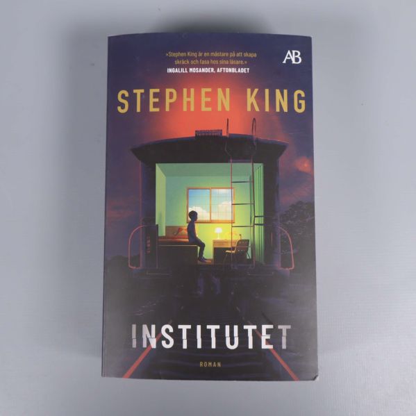 Framsida på Institutet av Stephen King med färgstarkt illustration av ett rum
