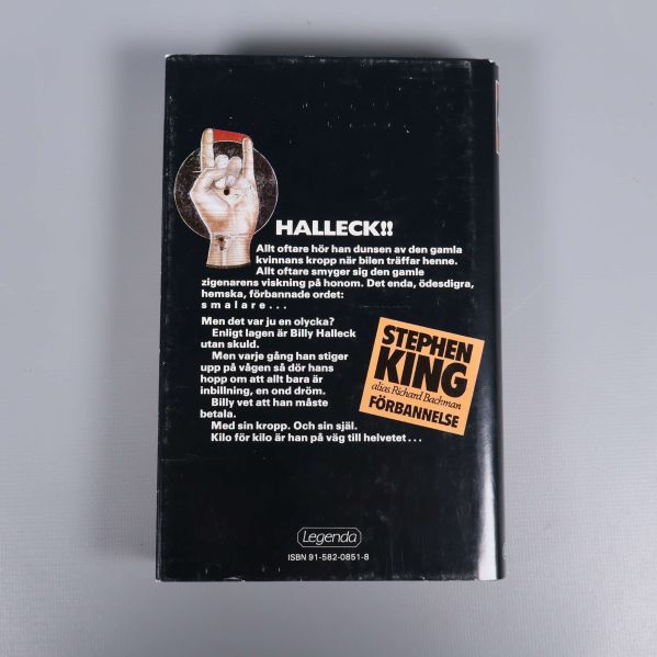 Baksida av Förbannelse av Stephen King med text och ISBN-nummer