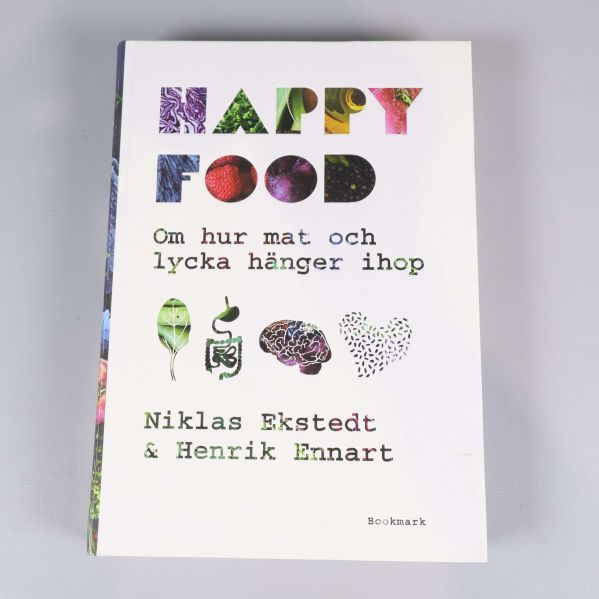 Framsidan av boken Happy Food med färgglad text och illustrationer