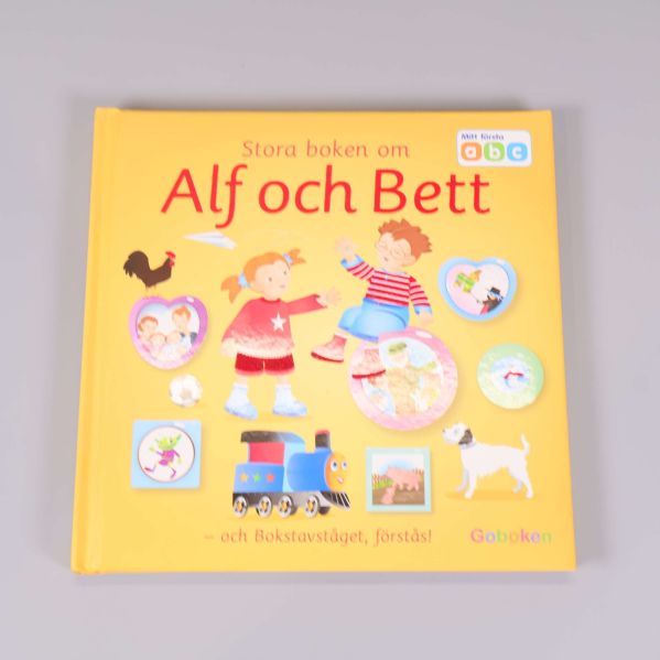 Framsida av Stora boken om Alf och Bett, gul pärm med figurer