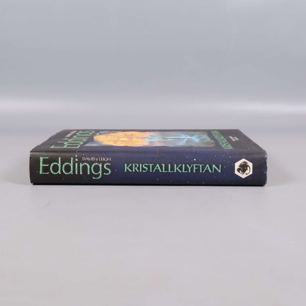 Bokrygg med titeln Kristallklyftan och författarnamn Eddings