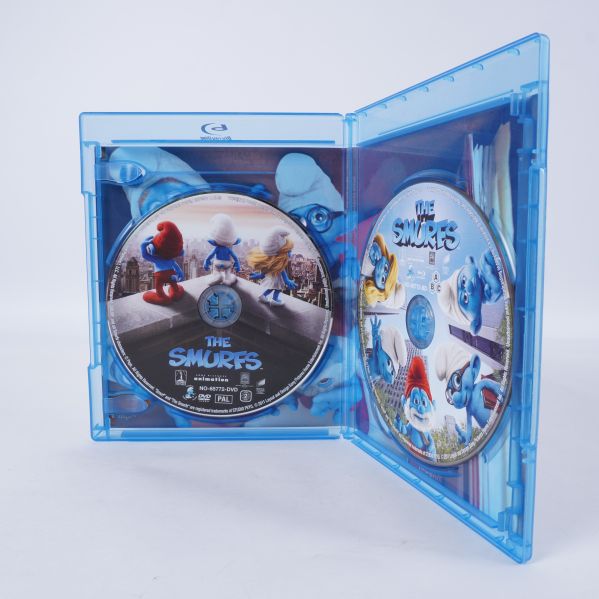 Insidan av fodralet visar två skivor med Smurfarna-motiv
