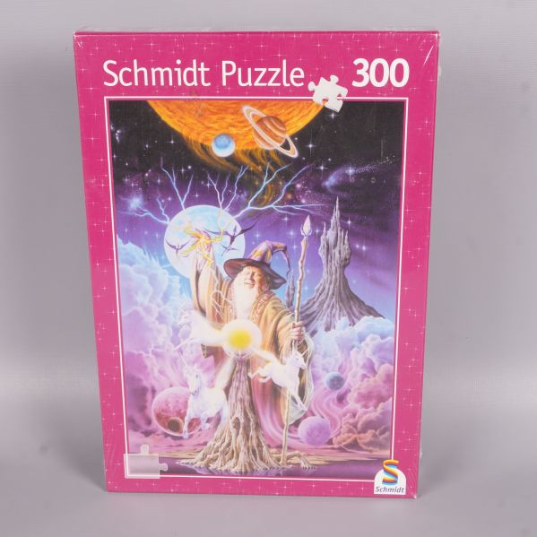 Framsidan av Schmidt pussel med trollkarl och enhörningar