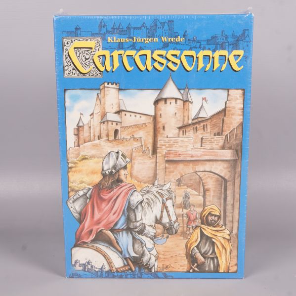 Framsidan av Carcassonne spelask med medeltida illustration
