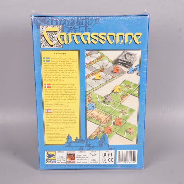 Baksidan av Carcassonne ask med spelbeskrivning och komponenter