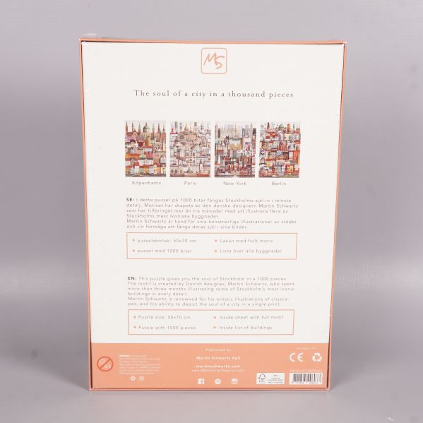 Baksidan av pusselboxen med beskrivning och andra städer