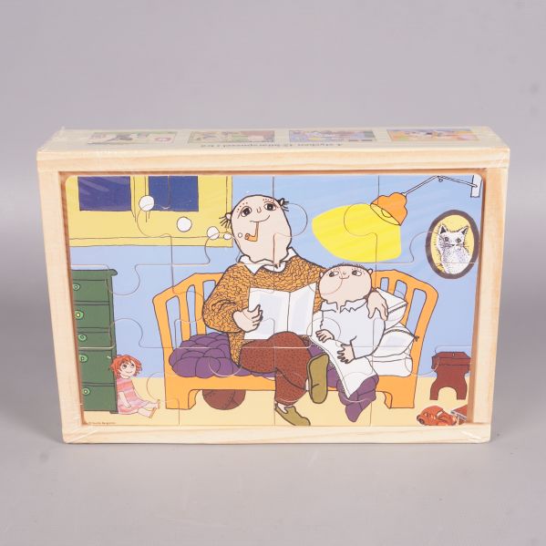 Alfons Åberg pussel sammansatt i öppen trälåda