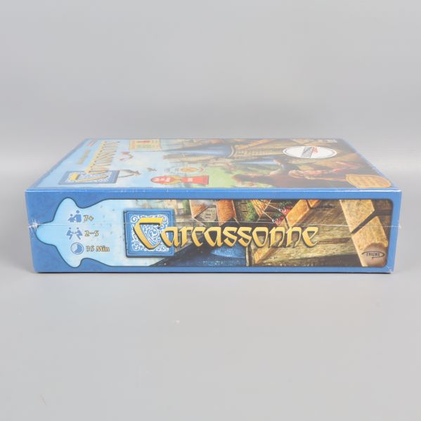 Carcassonne-lådans sida med illustration och logotyp