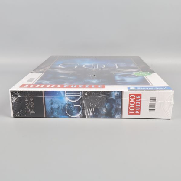 Pusselask liggande med Game of Thrones-tryck