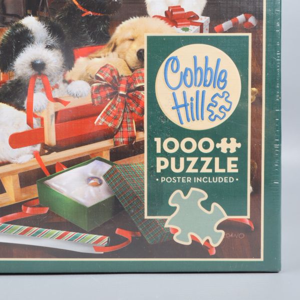 Framsida av Cobble Hill pussellåda med hundmotiv och logga