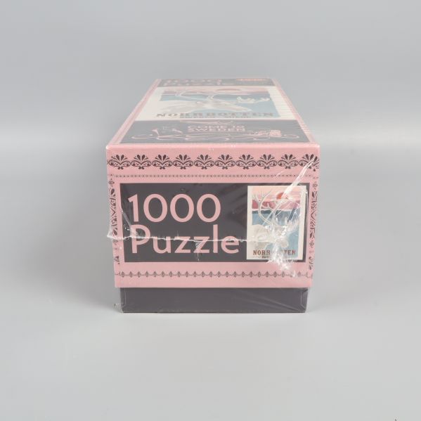 Gavelsida av pusselask med text 1000 Puzzle