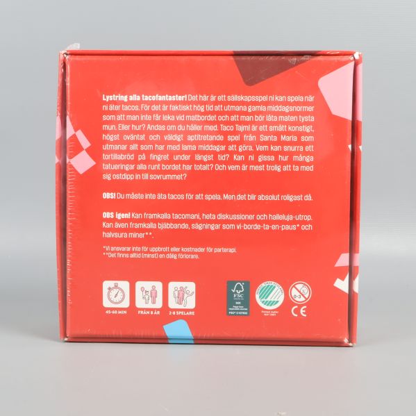 Baksidan av Taco Tajm spelask med regler och spelbeskrivning