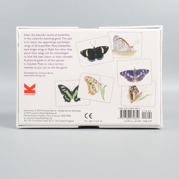 Baksidan av boxen med spelbeskrivning och fjärilar