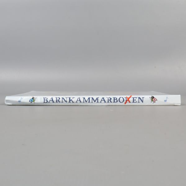 Bokryggen där Barnkammarboken står tryckt i blå bokstäver