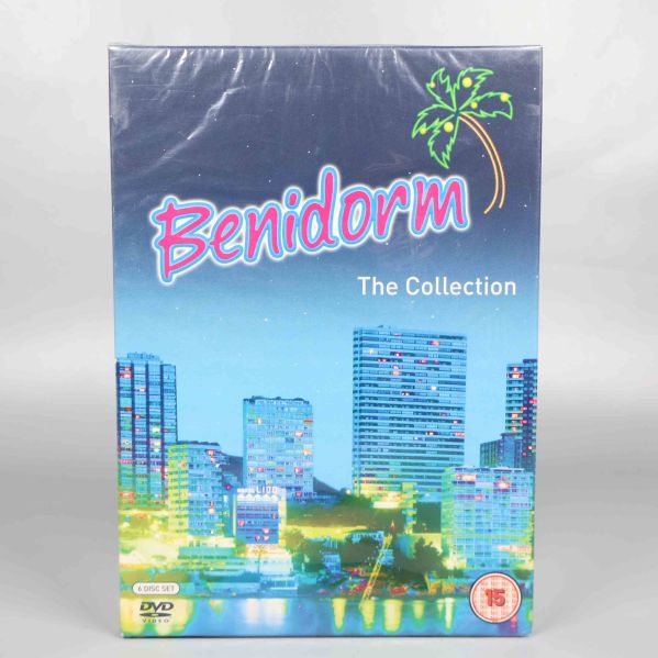 Framsidan av Benidorm The Collection dvd-box med palm och stadssilhuett