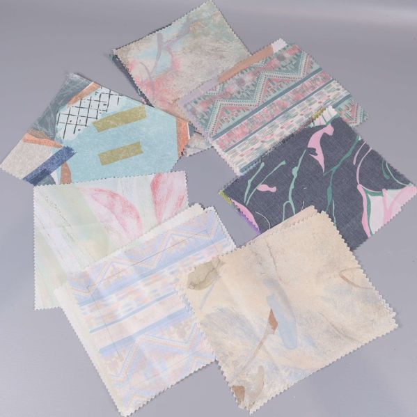 Sex tygprover med pastellfärgade abstrakta och blommiga mönster