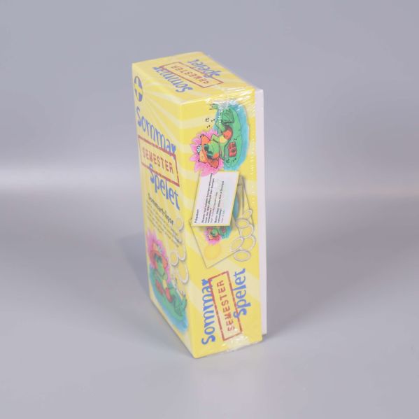 Sommar Semesterspelet i plastfolie med synlig etikett