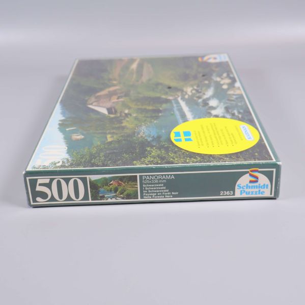 Sida av pusselbox visar antal bitar och logotyp