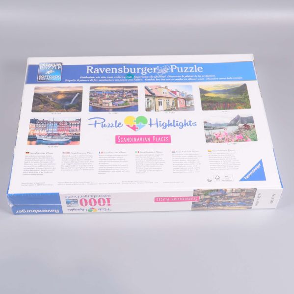 Baksidan av pussellåda med olika motiv och text