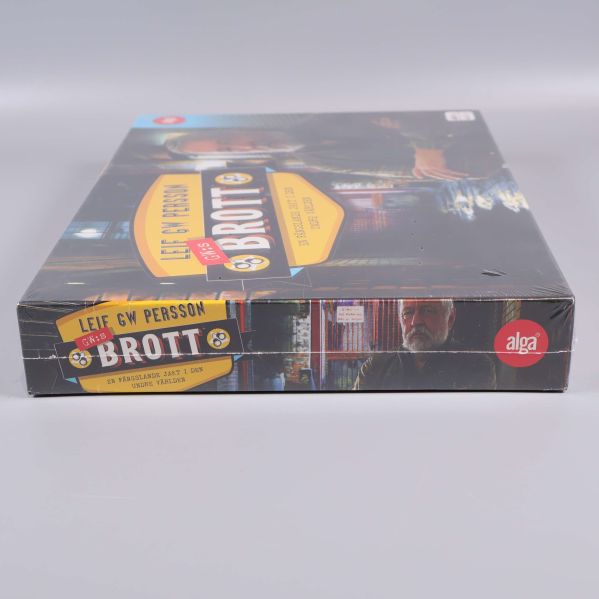 Spelkartong sedd från sidan med titel och Alga-logga