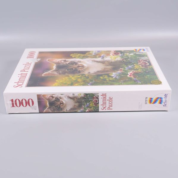 Sidan av pussellådan med text och pusselbit