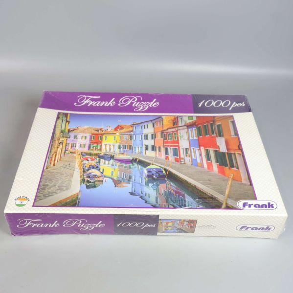 pussel i lila kartong med stadsmotiv och 1000 bitar