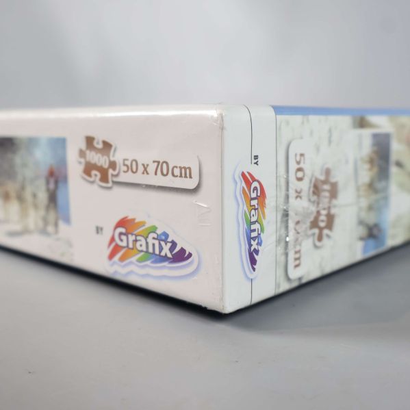 Närbild på hörnet av pusselask med Grafix-logotyp