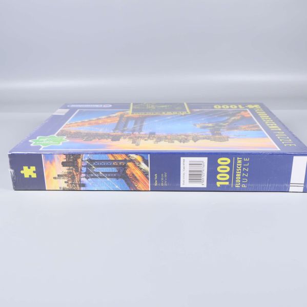 Sida av pussellåda med antal bitar och storlek