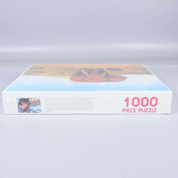 Sidan av pussellådan visar texten 1000 piece puzzle i rött