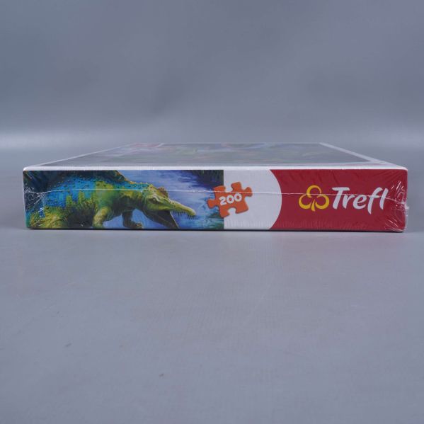 Kort sida på Trefl pussel med krokodiliknande dinosaurie