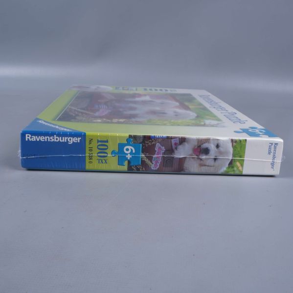 Ravensburger pusselask med tydligt varumärke på kanten