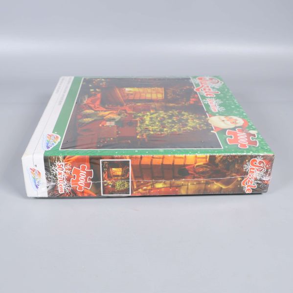 Pusslets smala sida med julmotiv och logga