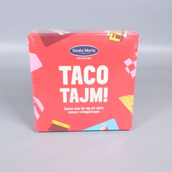 Framsidan av Taco Tajm-spel med röd box och grafiska detaljer