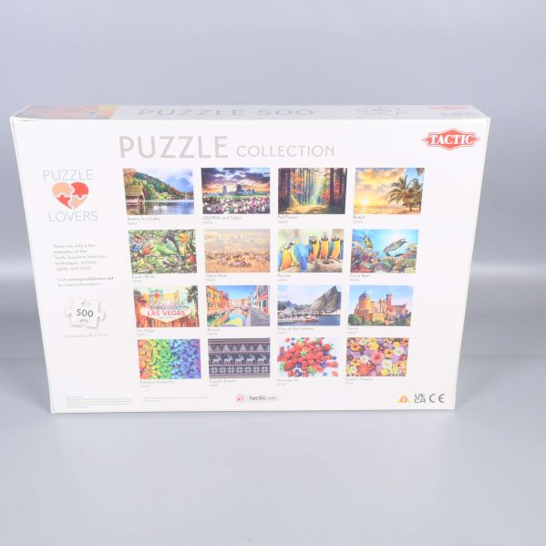 Baksidan av pussellådan med flera motiv från samma serie