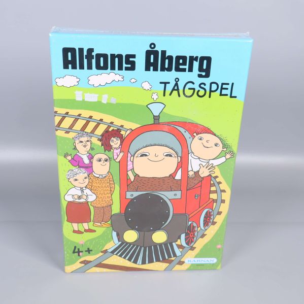 Framsida på Alfons Åberg tågspel med färgglad illustration