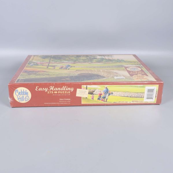 Sida av pusselkartongen med Easy Handling-text