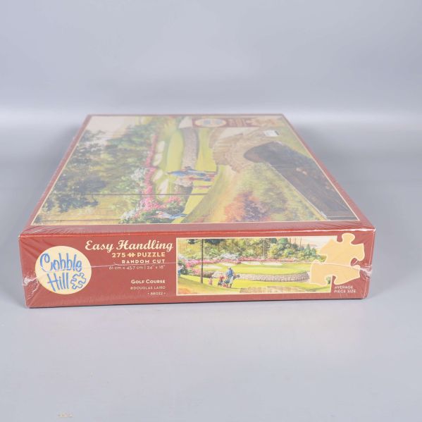 Undersida av kartong med Easy Handling och motiv