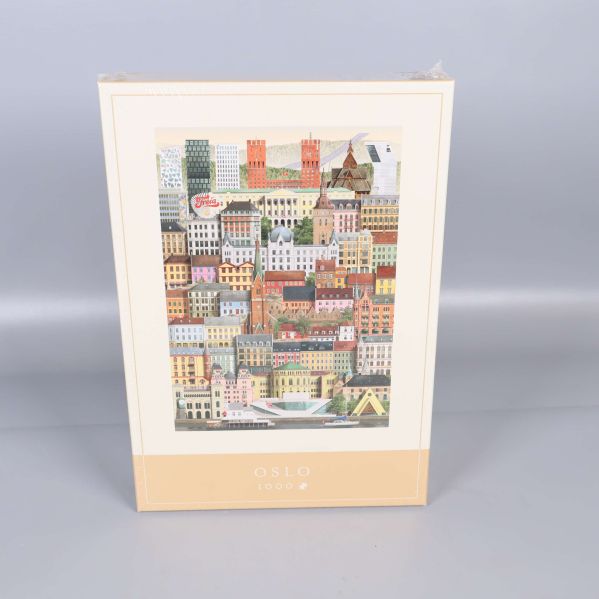 Framsidan på pussellådan med Oslomotiv och 1000 bitar