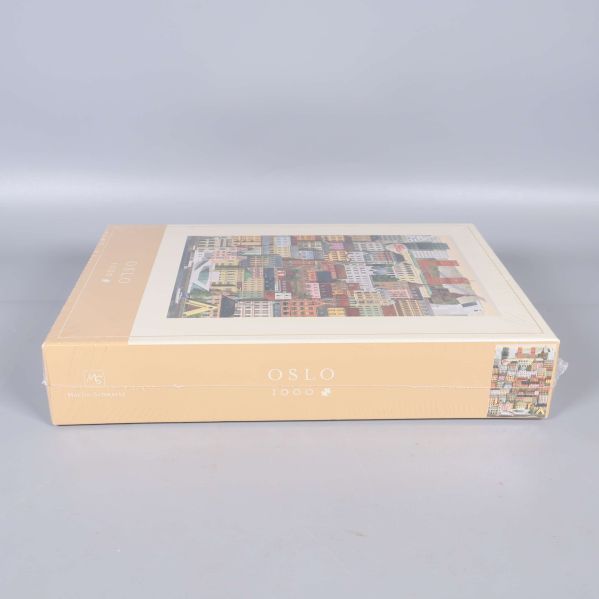 Sida av pussellådan med Oslo 1000 tryckt