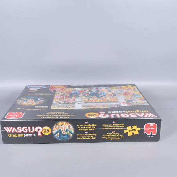 Sida av Wasgij pusselbox med originalpuzzle logotyp och motiv