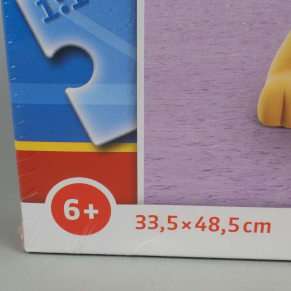 Åldersrekommendation 6+ och mått på framsidan av pussellådan