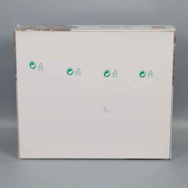 Baksida av pusselkartongen med återvinningssymboler