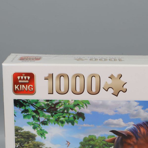 Närbild av King logotyp och 1000 bitar text